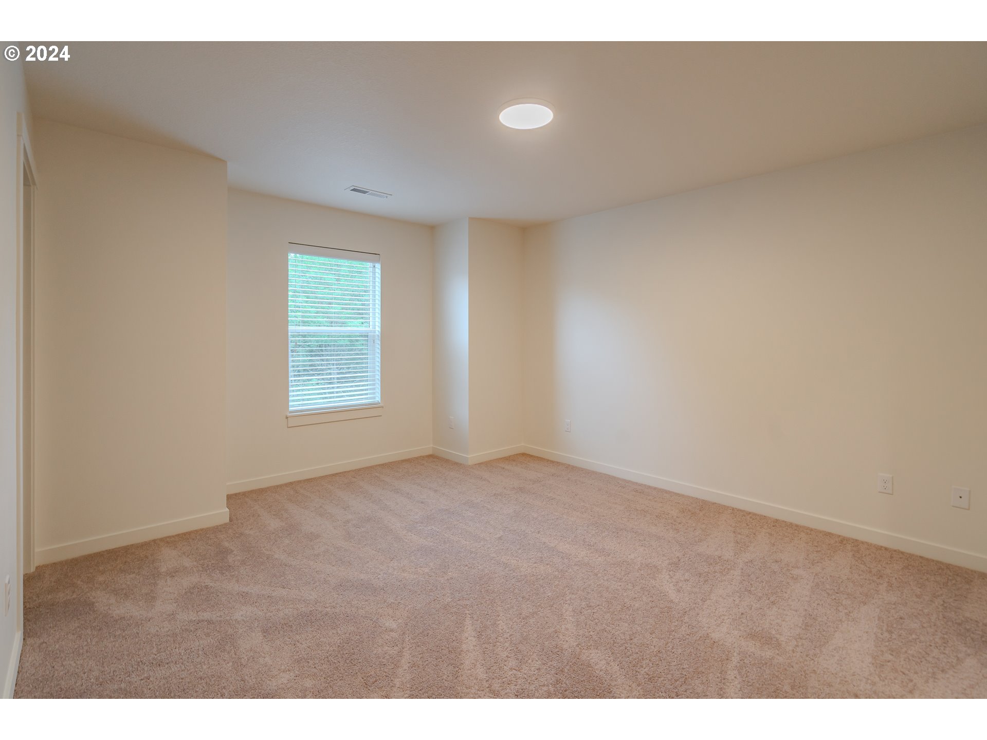 349 South 69th Place Ridgefield, WA 98642 - Photo 17 of 45 a view of an empty room with a window