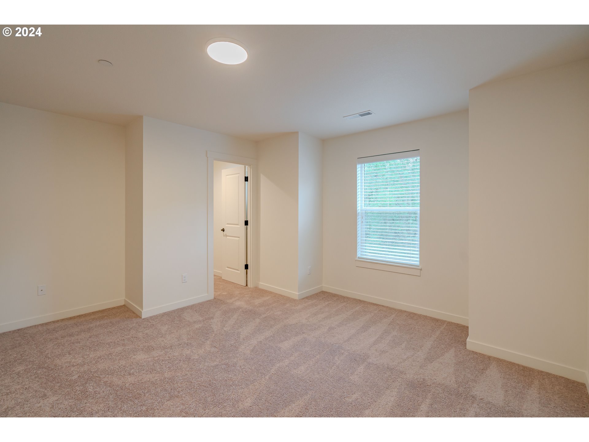 349 South 69th Place Ridgefield, WA 98642 - Photo 18 of 45 a view of an empty room with a window