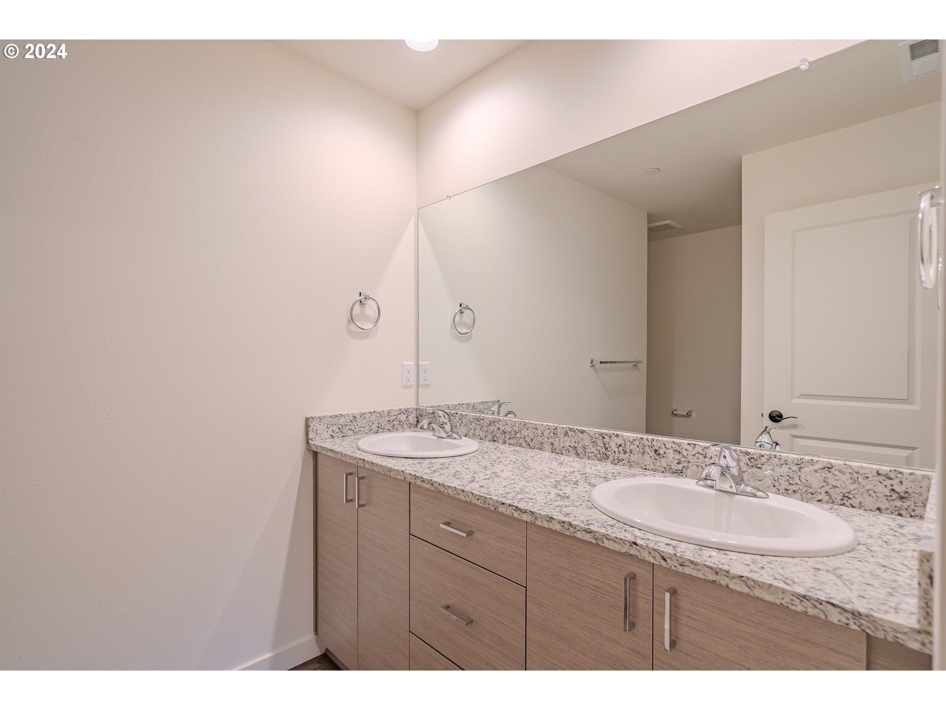 349 South 69th Place Ridgefield, WA 98642 - Photo 22 of 45 a bathroom with a granite countertop sink and a mirror