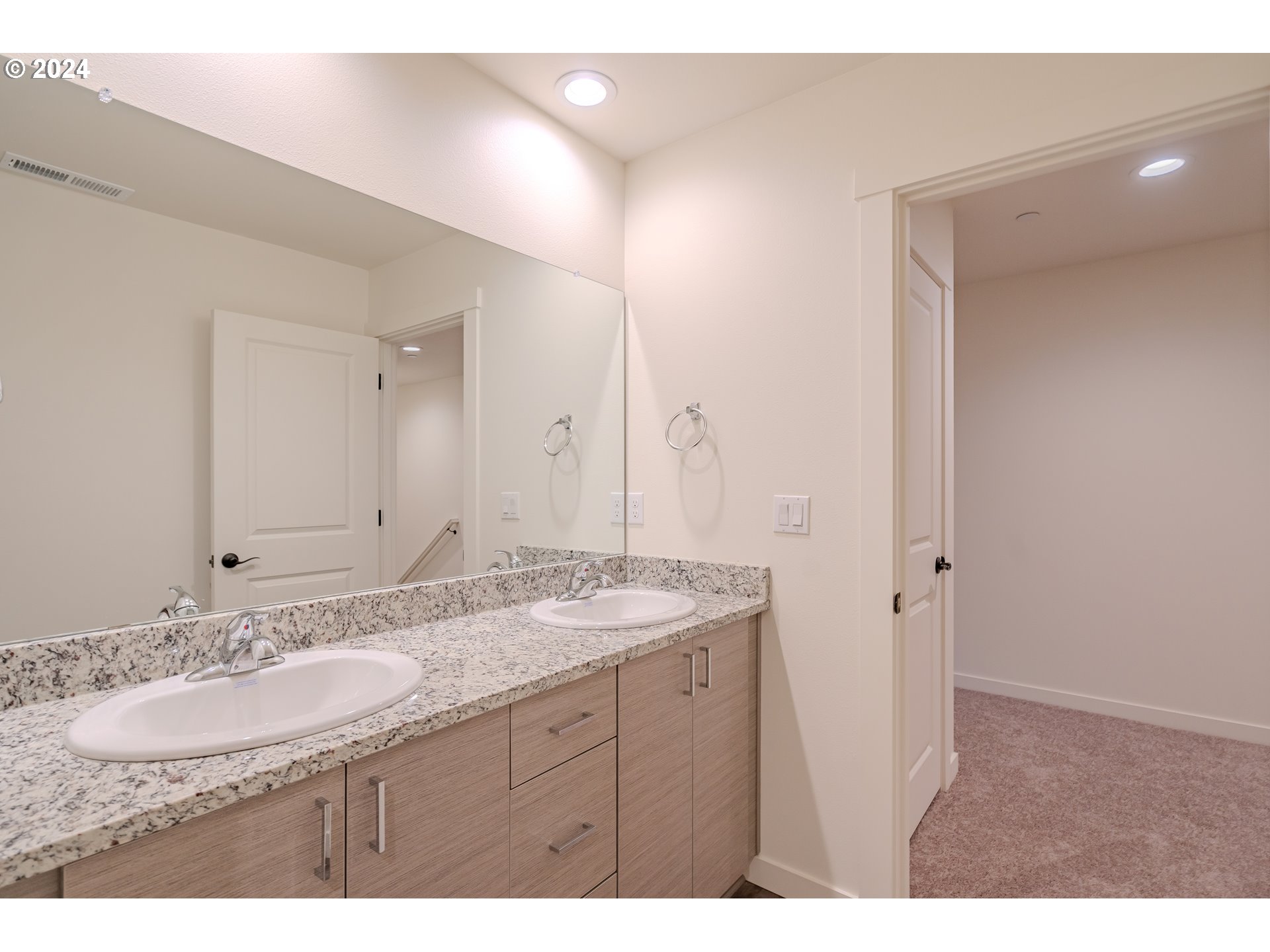 349 South 69th Place Ridgefield, WA 98642 - Photo 29 of 45 a bathroom with a granite countertop sink and a mirror