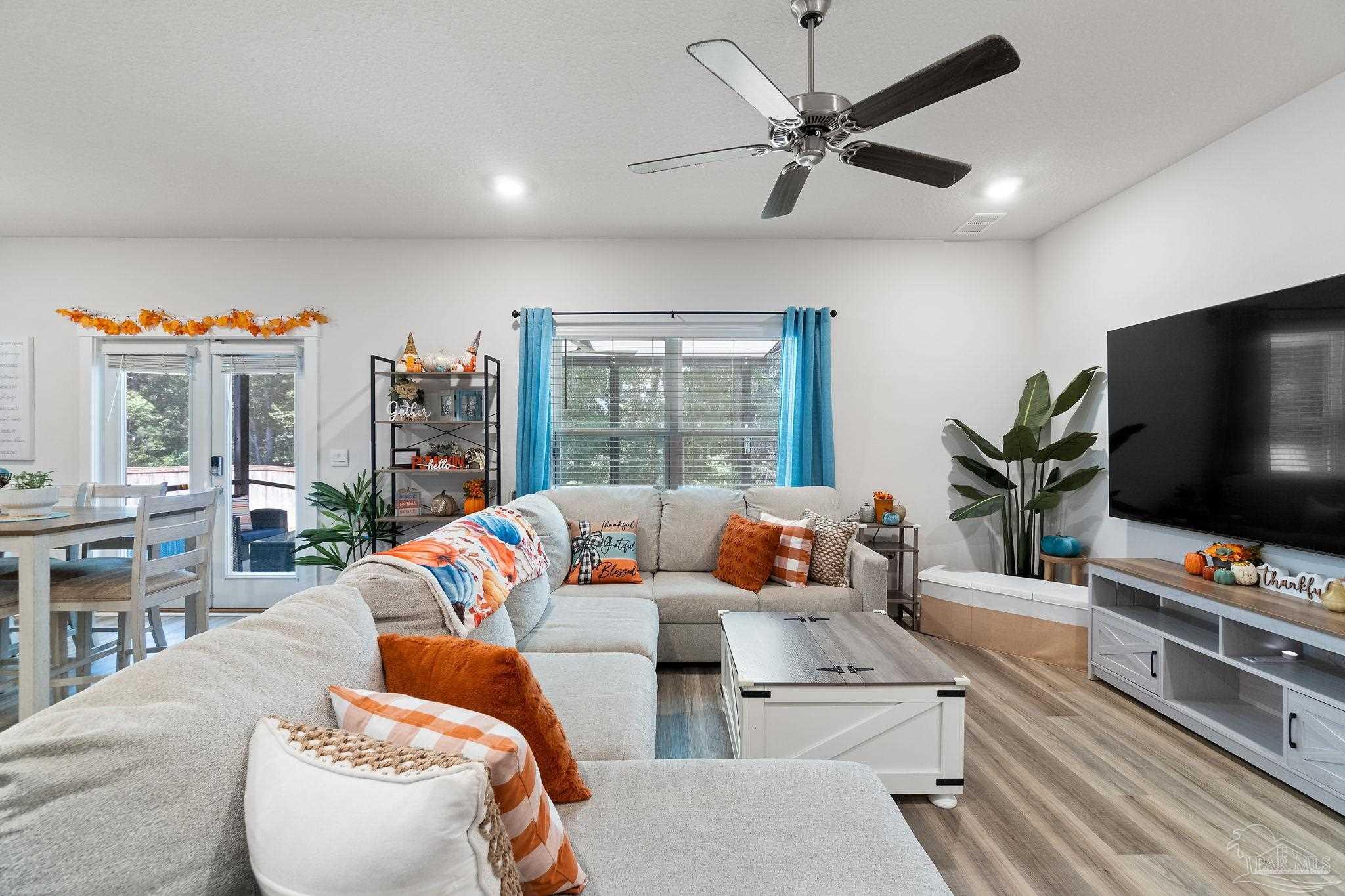 6060 Rutherford Loop Pensacola, FL 32526 - Photo 12 of 44 a living room with furniture and a flat screen tv