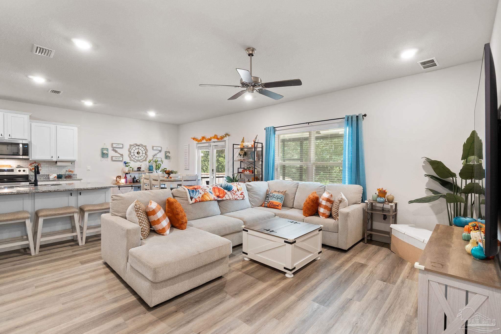 6060 Rutherford Loop Pensacola, FL 32526 - Photo 13 of 44 a living room with furniture fireplace and window