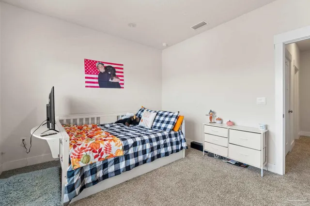 a bedroom with furniture and a bed