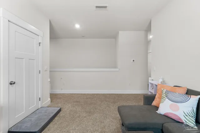 a living room with furniture and a gate