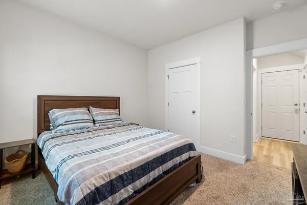 a bedroom with a bed and a view of bedroom