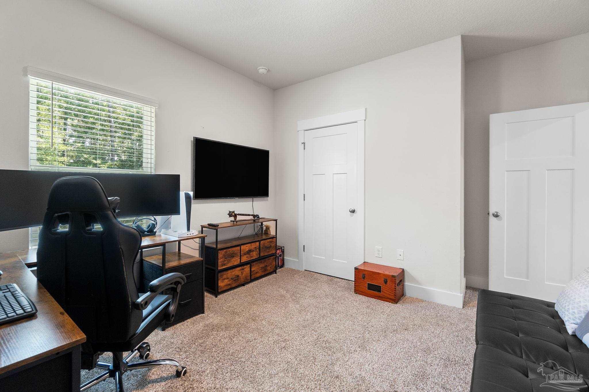 6060 Rutherford Loop Pensacola, FL 32526 - Photo 36 of 44 a living room with furniture and a flat screen tv