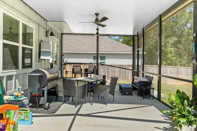 a living room with large windows