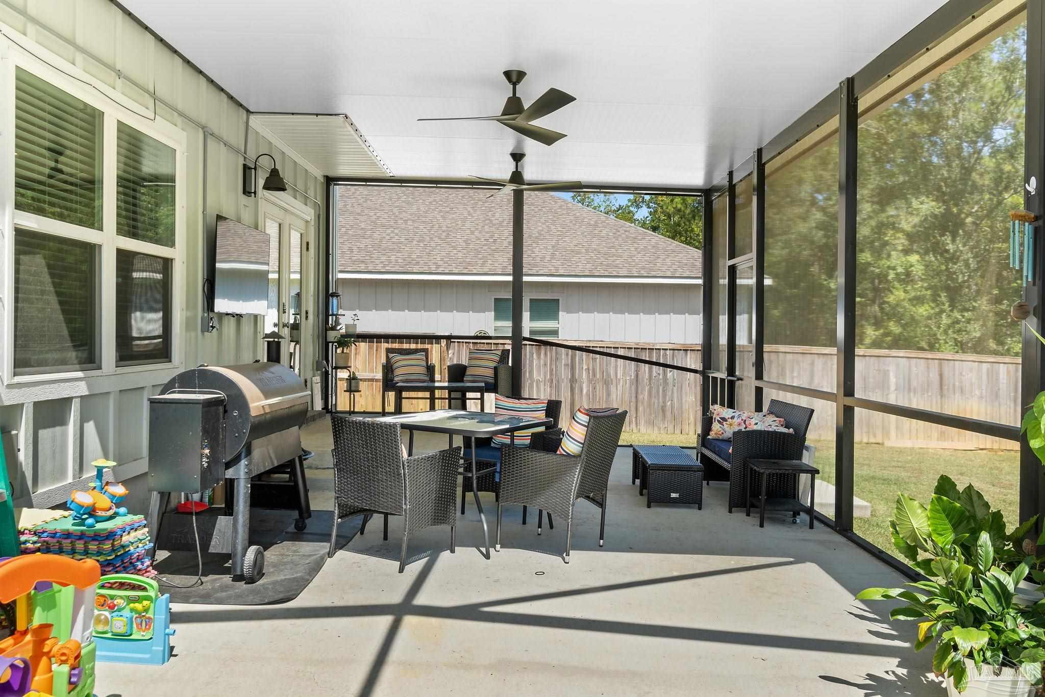 6060 Rutherford Loop Pensacola, FL 32526 - Photo 39 of 44 a living room with large windows