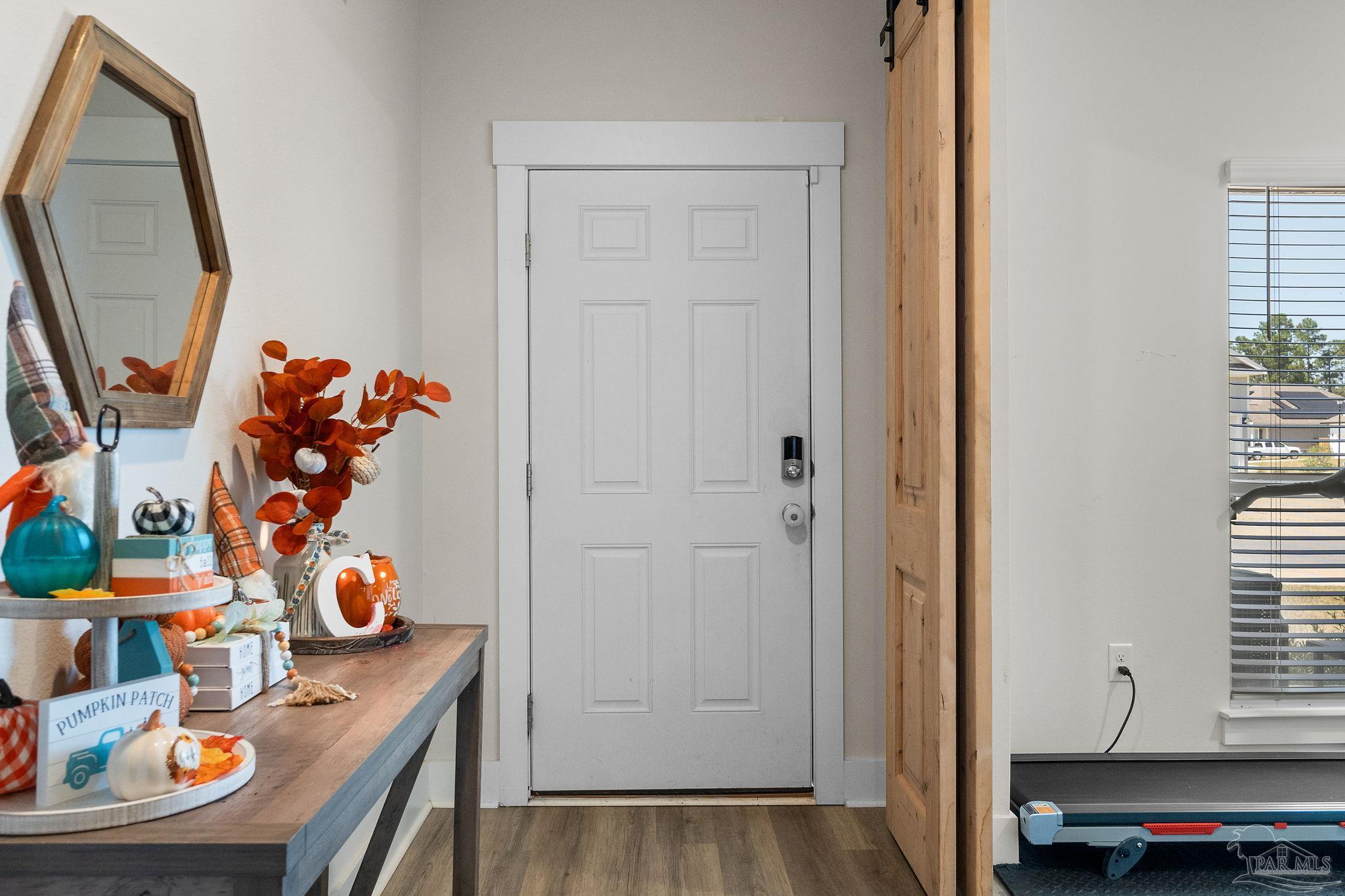 6060 Rutherford Loop Pensacola, FL 32526 - Photo 4 of 44 a view of a dining room with furniture and wooden floor