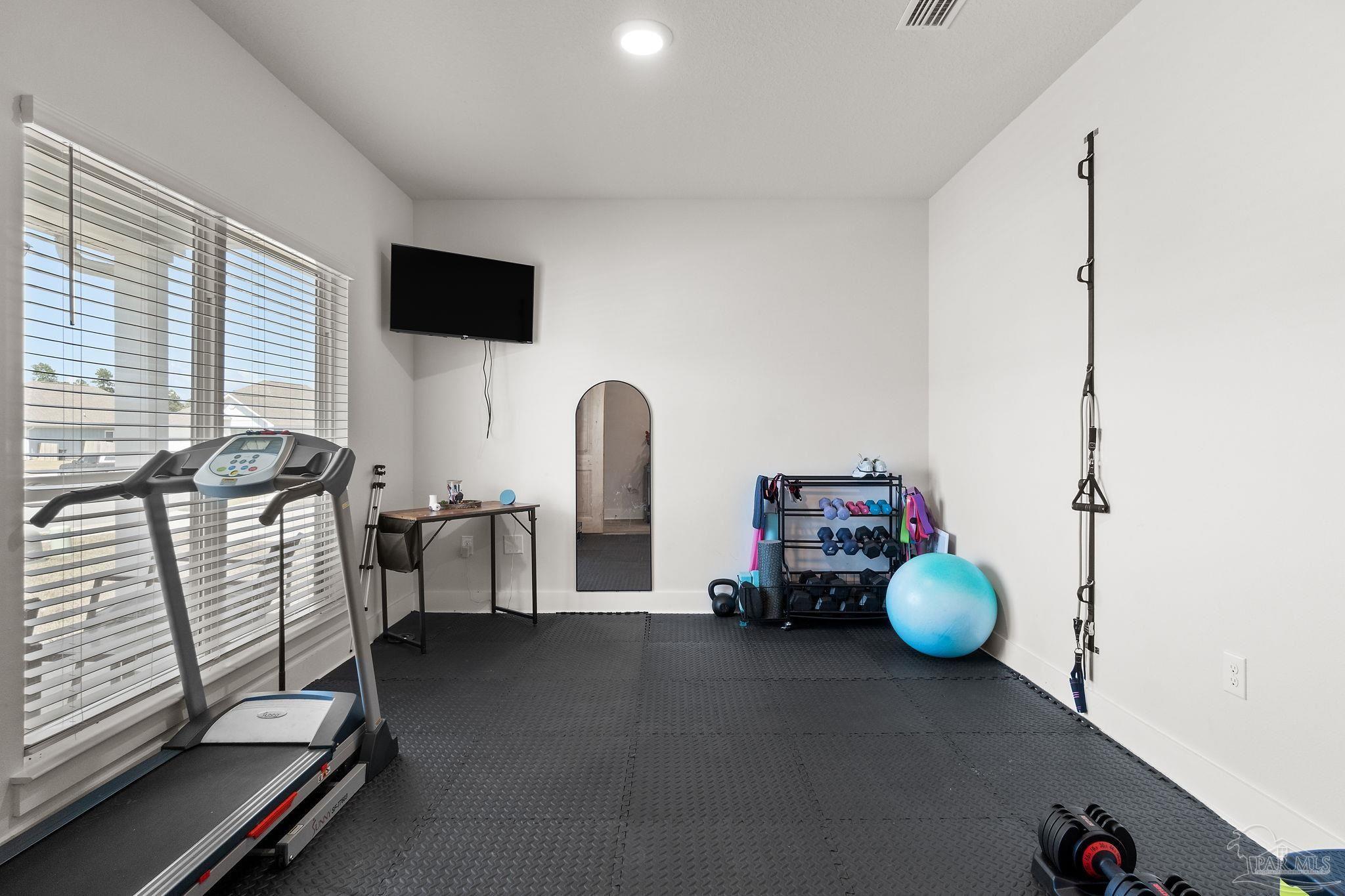 6060 Rutherford Loop Pensacola, FL 32526 - Photo 9 of 44 a living room with furniture and a flat screen tv