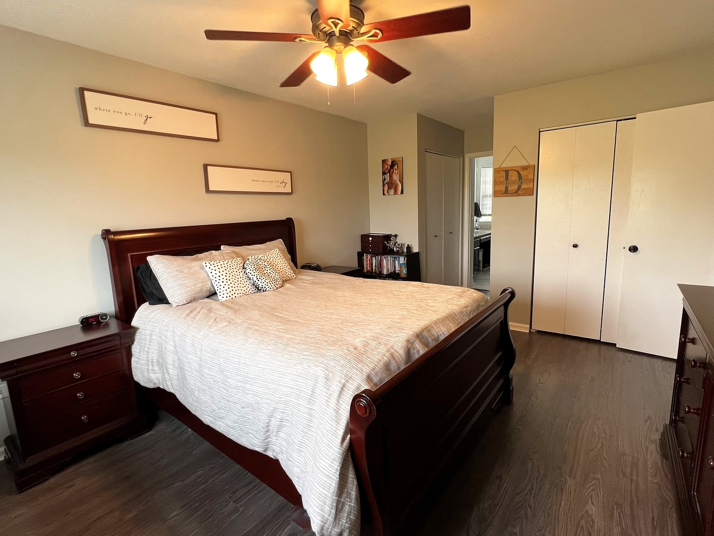 8563 Scheer Drive, Unit 8563 Tinley Park, IL 60487 - Photo 13 of 30 a bedroom with a bed and a chandelier