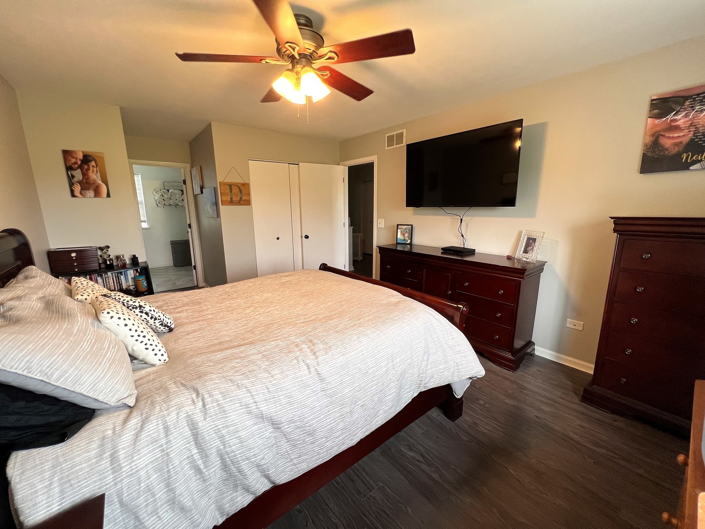 8563 Scheer Drive, Unit 8563 Tinley Park, IL 60487 - Photo 14 of 30 a bedroom with a bed and a flat tv screen on dresser