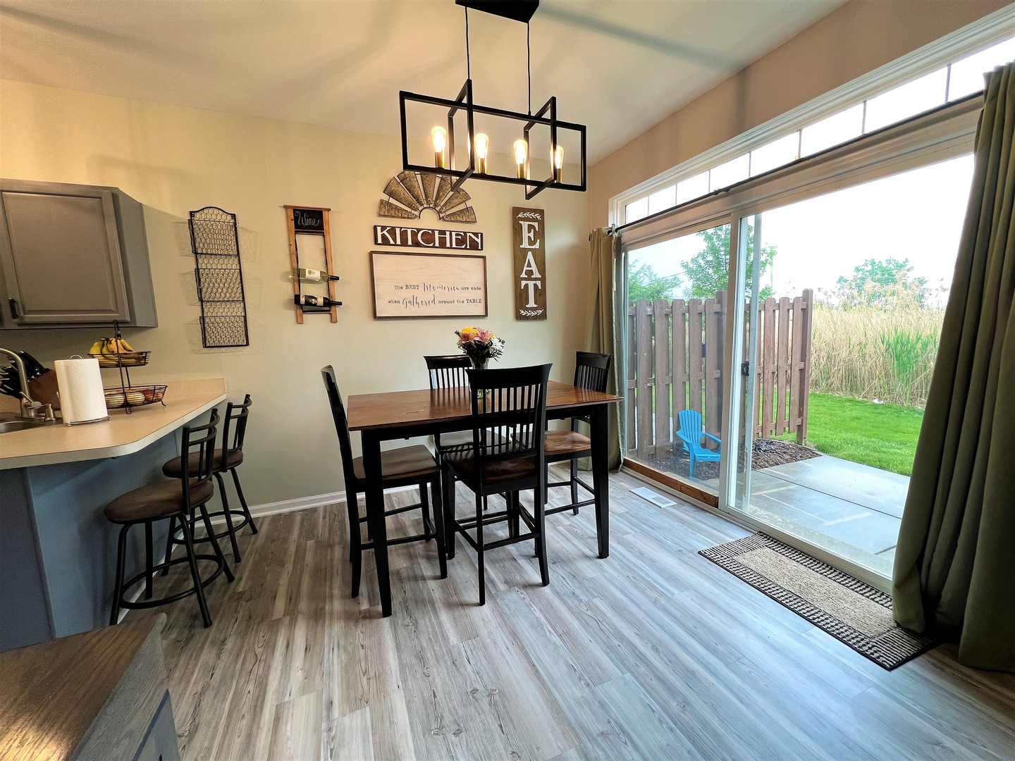 8563 Scheer Drive, Unit 8563 Tinley Park, IL 60487 - Photo 6 of 30 a view of a dining room with furniture window and wooden floor