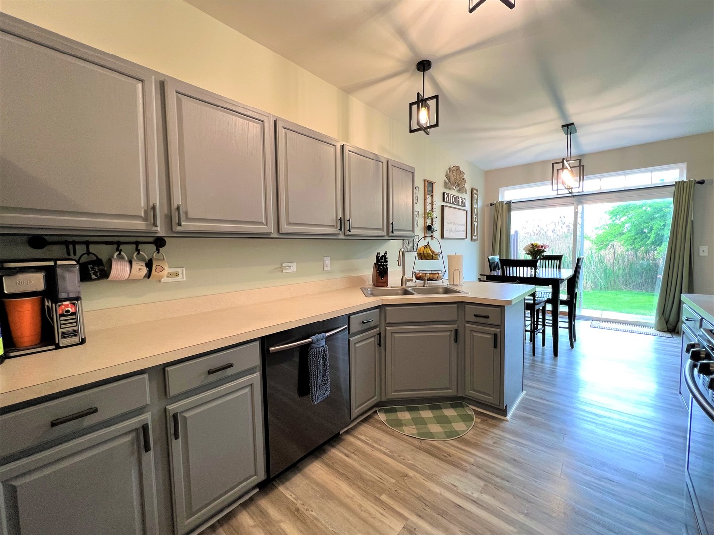8563 Scheer Drive, Unit 8563 Tinley Park, IL 60487 - Photo 10 of 30 a kitchen with a sink cabinets and window