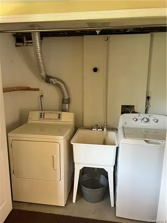 a bathroom with a sink toilet and mirror