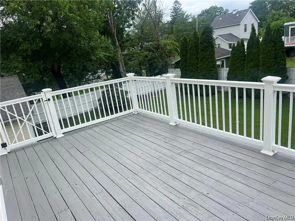a view of a house with a yard and table and chair