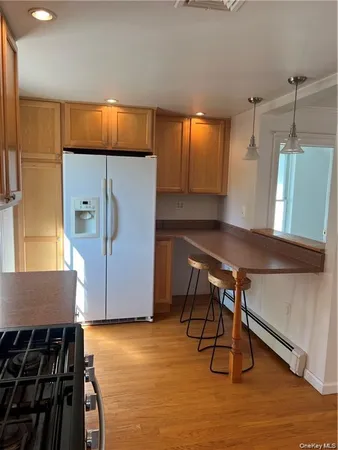 a kitchen with a table and chairs