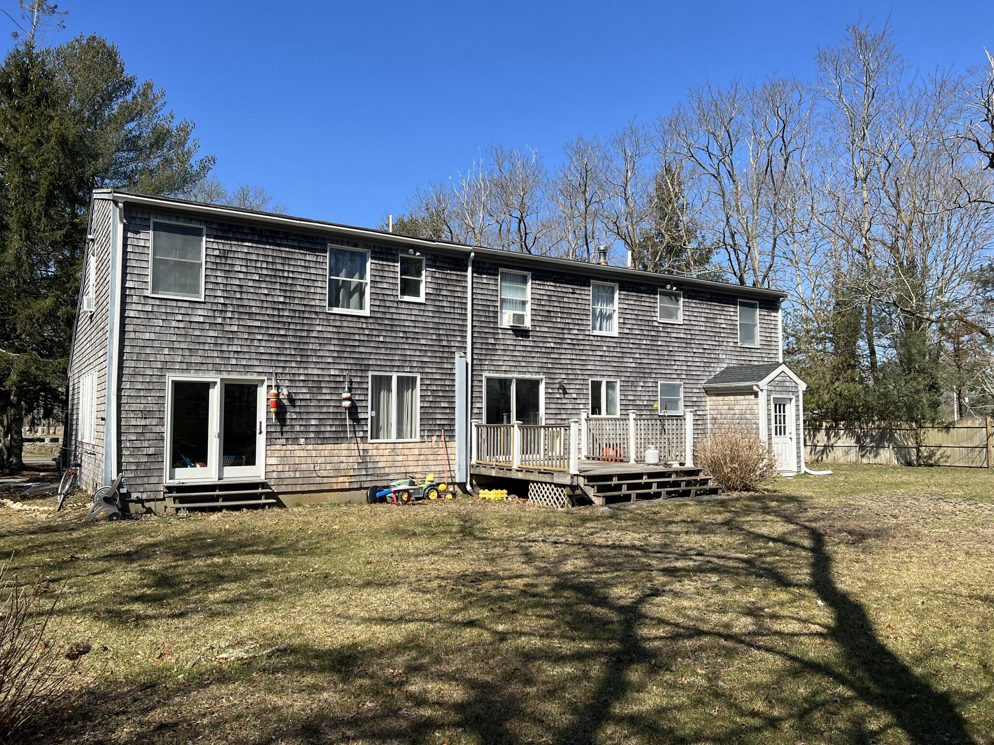 413 County Road Pocasset, MA 02559 - Photo 14 of 21 a front view of a house with a yard