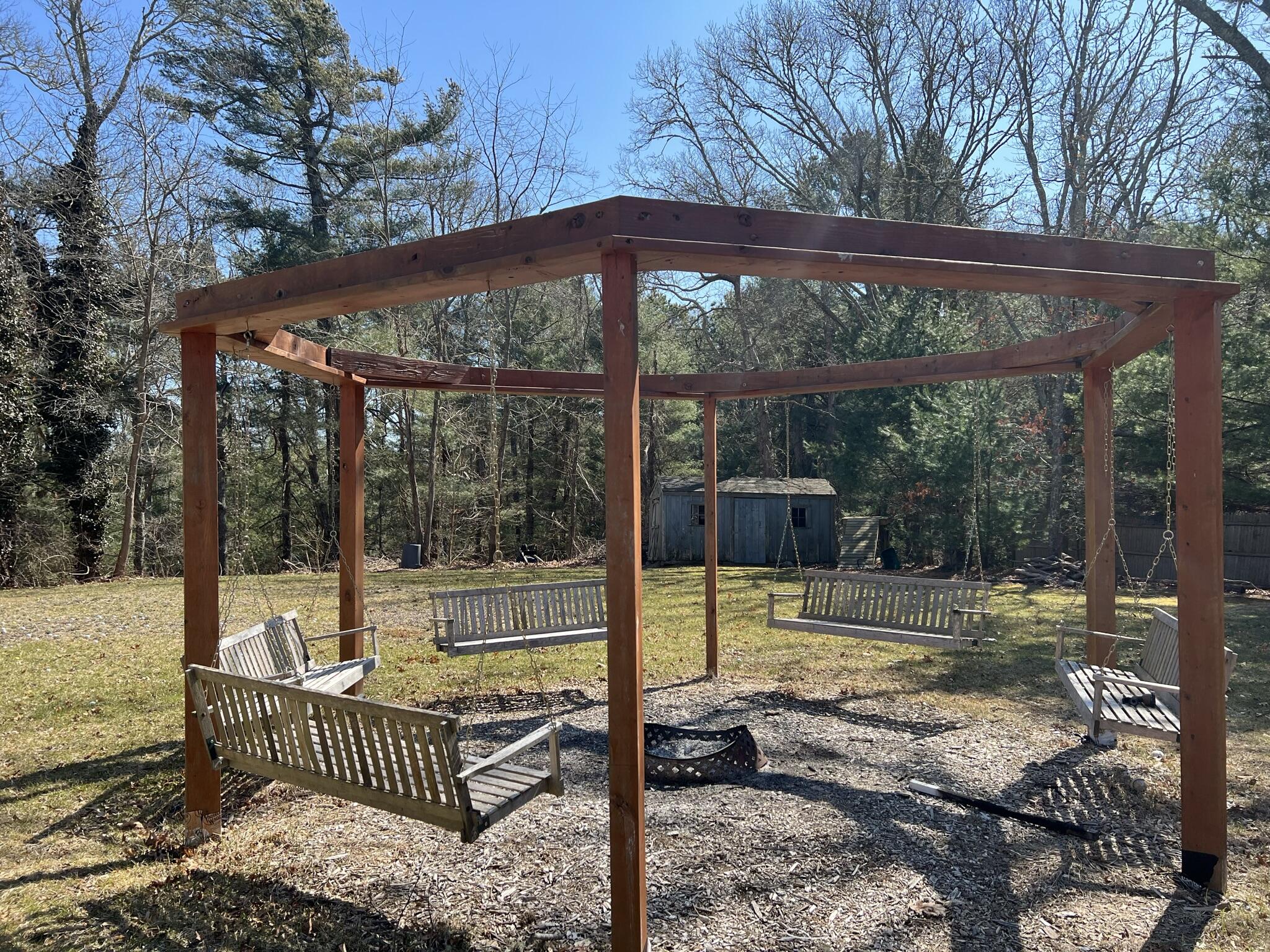 413 County Road Pocasset, MA 02559 - Photo 15 of 21 a view of a patio with a table chairs and a backyard