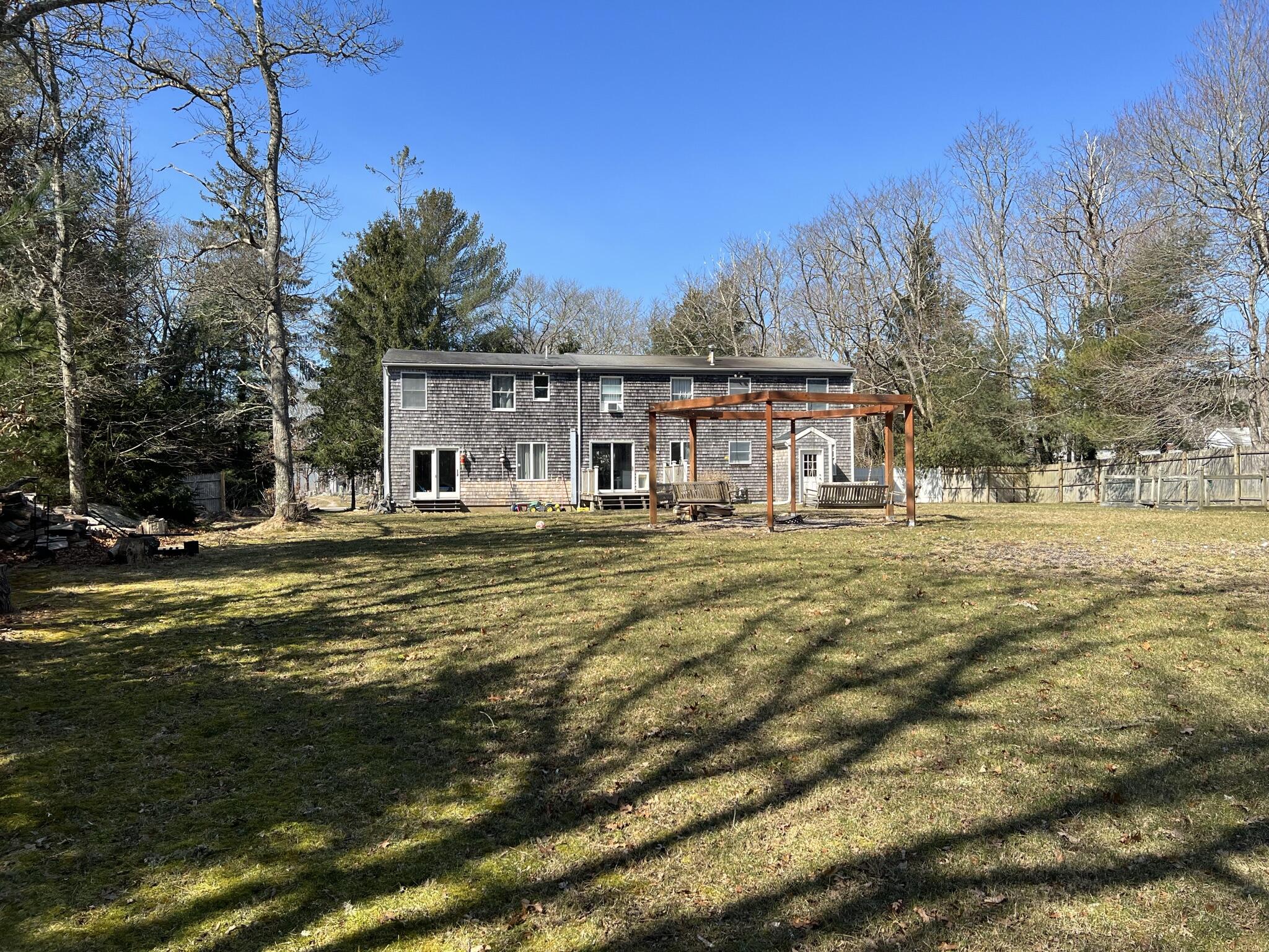 413 County Road Pocasset, MA 02559 - Photo 18 of 21 a front view of a house with a yard