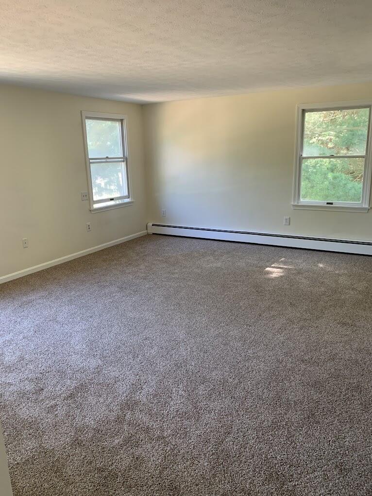 413 County Road Pocasset, MA 02559 - Photo 8 of 21 an empty room with windows