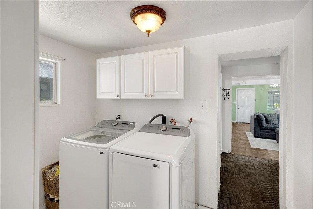 1003 West Stevenson Street Colton, CA 92324 - Photo 13 of 27 a view of a storage & utility room with a sink washer and dryer
