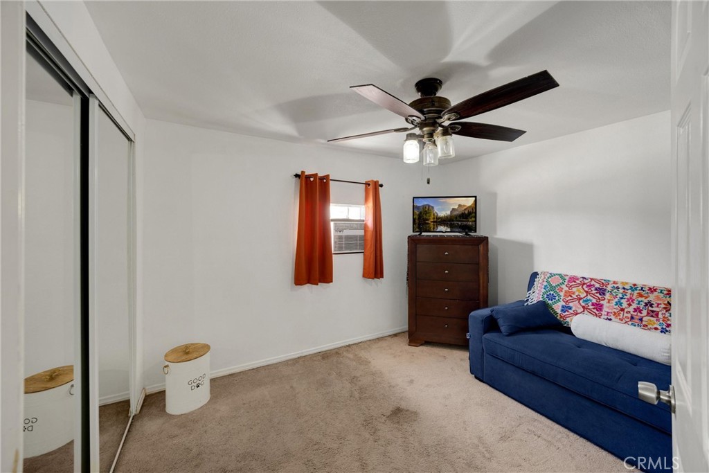1003 West Stevenson Street Colton, CA 92324 - Photo 16 of 27 a living room with furniture and a chandelier