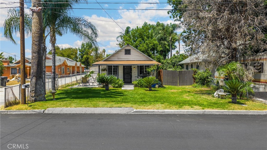 1003 West Stevenson Street Colton, CA 92324 - Photo 20 of 27 a view of a house with a yard and palm trees