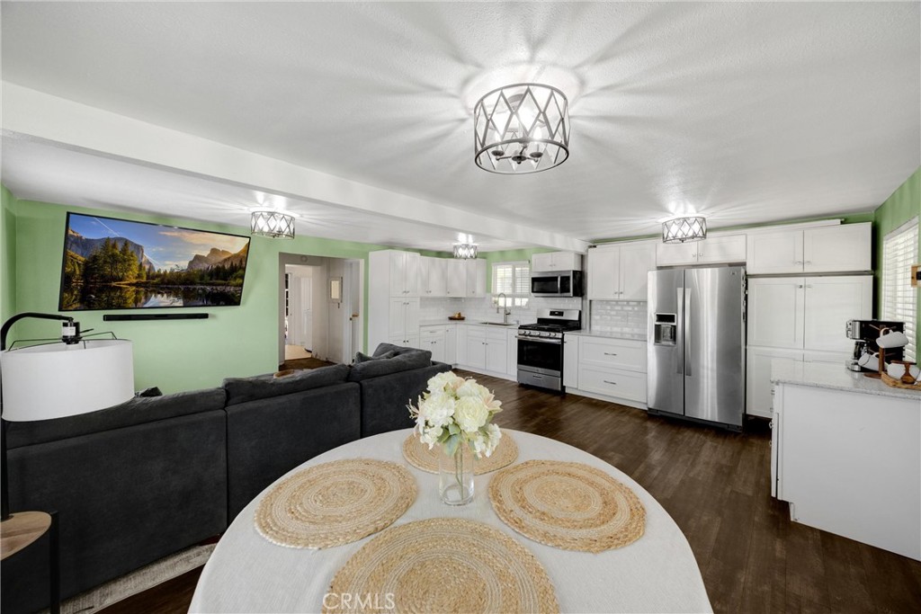 1003 West Stevenson Street Colton, CA 92324 - Photo 7 of 27 a view of a dining room with furniture and a chandelier