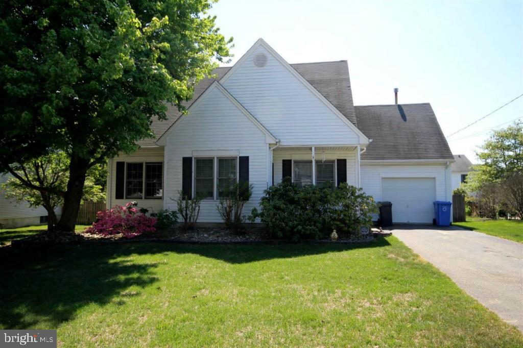 228 Schooner Road Manahawkin, NJ 08050 - Photo 1 of 19 a front view of house with yard and green space