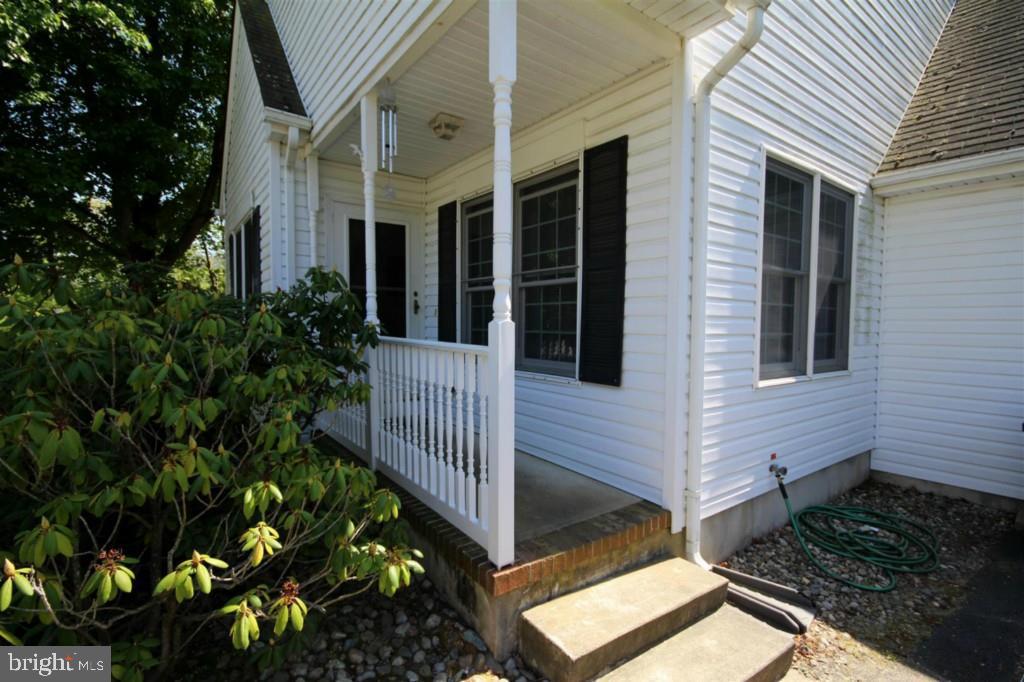 228 Schooner Road Manahawkin, NJ 08050 - Photo 2 of 19 a view of a house with a yard and potted plants