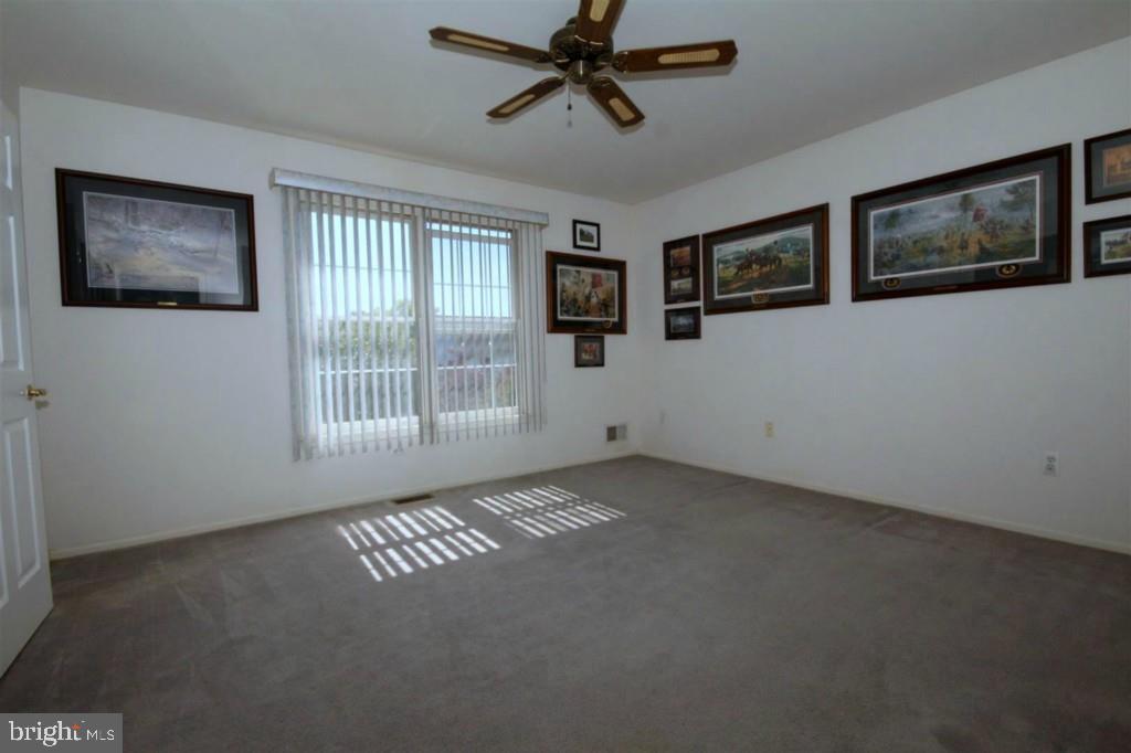 228 Schooner Road Manahawkin, NJ 08050 - Photo 15 of 19 a view of an empty room with a window