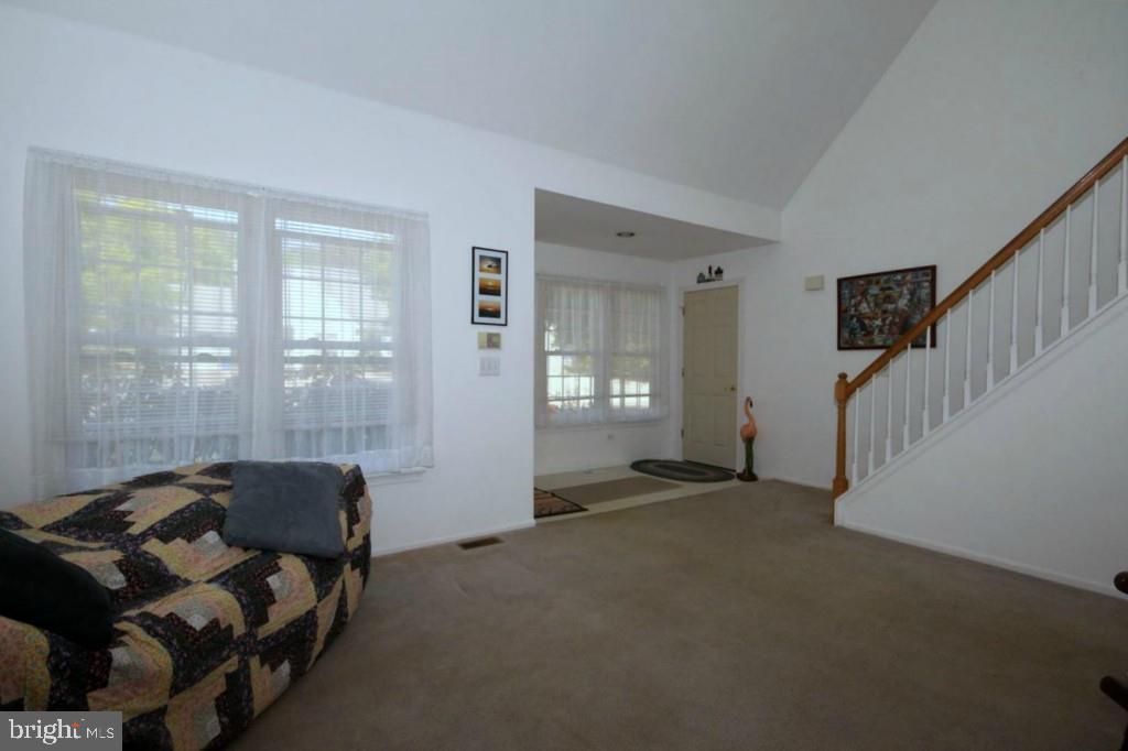 228 Schooner Road Manahawkin, NJ 08050 - Photo 4 of 19 a living room with furniture and a window