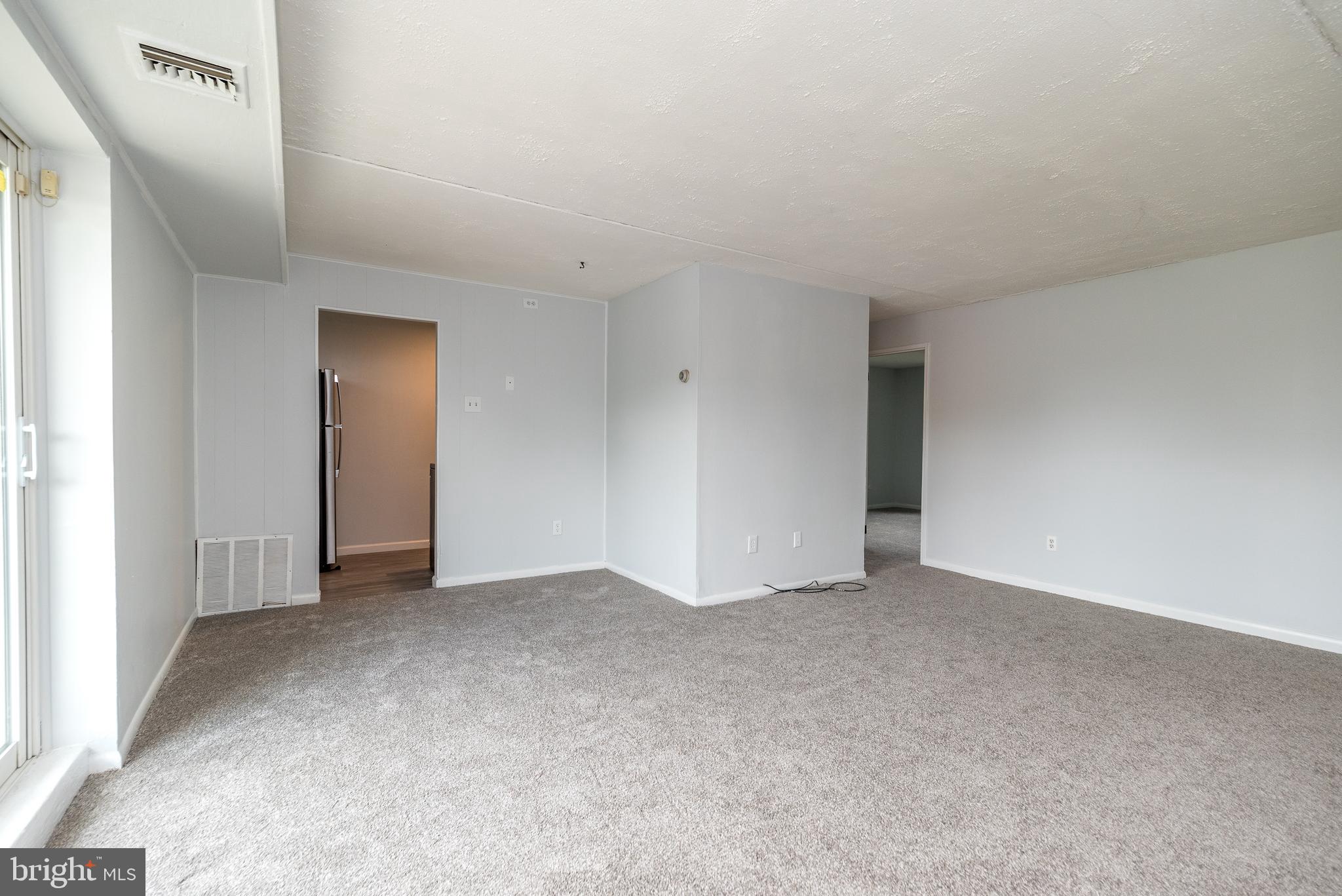885 North York Road, Unit 29A Warminster, PA 18974 - Photo 6 of 23 Living/Dining Room-door to Kitchen