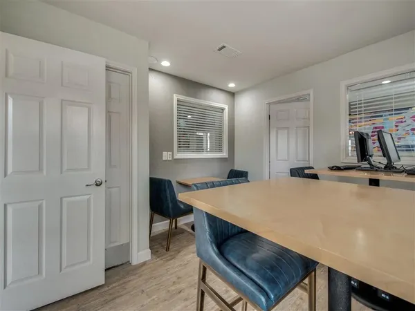 a dining room with furniture and window