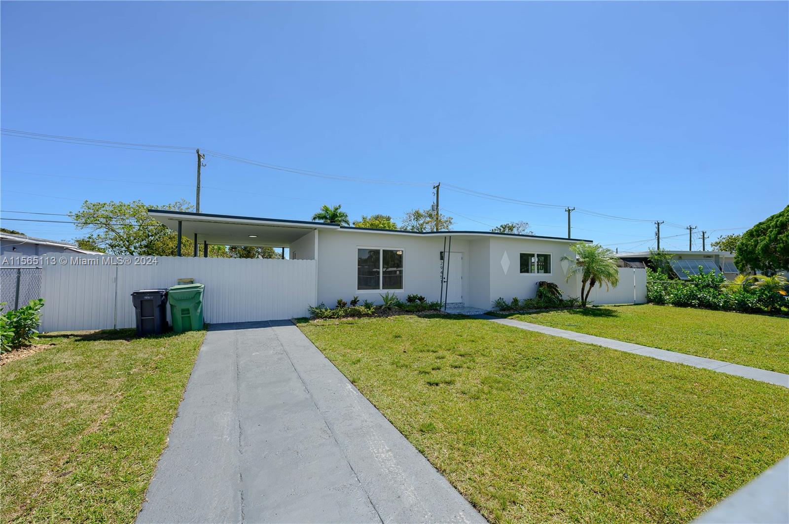29451 Maine Road Homestead, FL 33033 - Photo 1 of 22 a front view of a house with a yard and garage