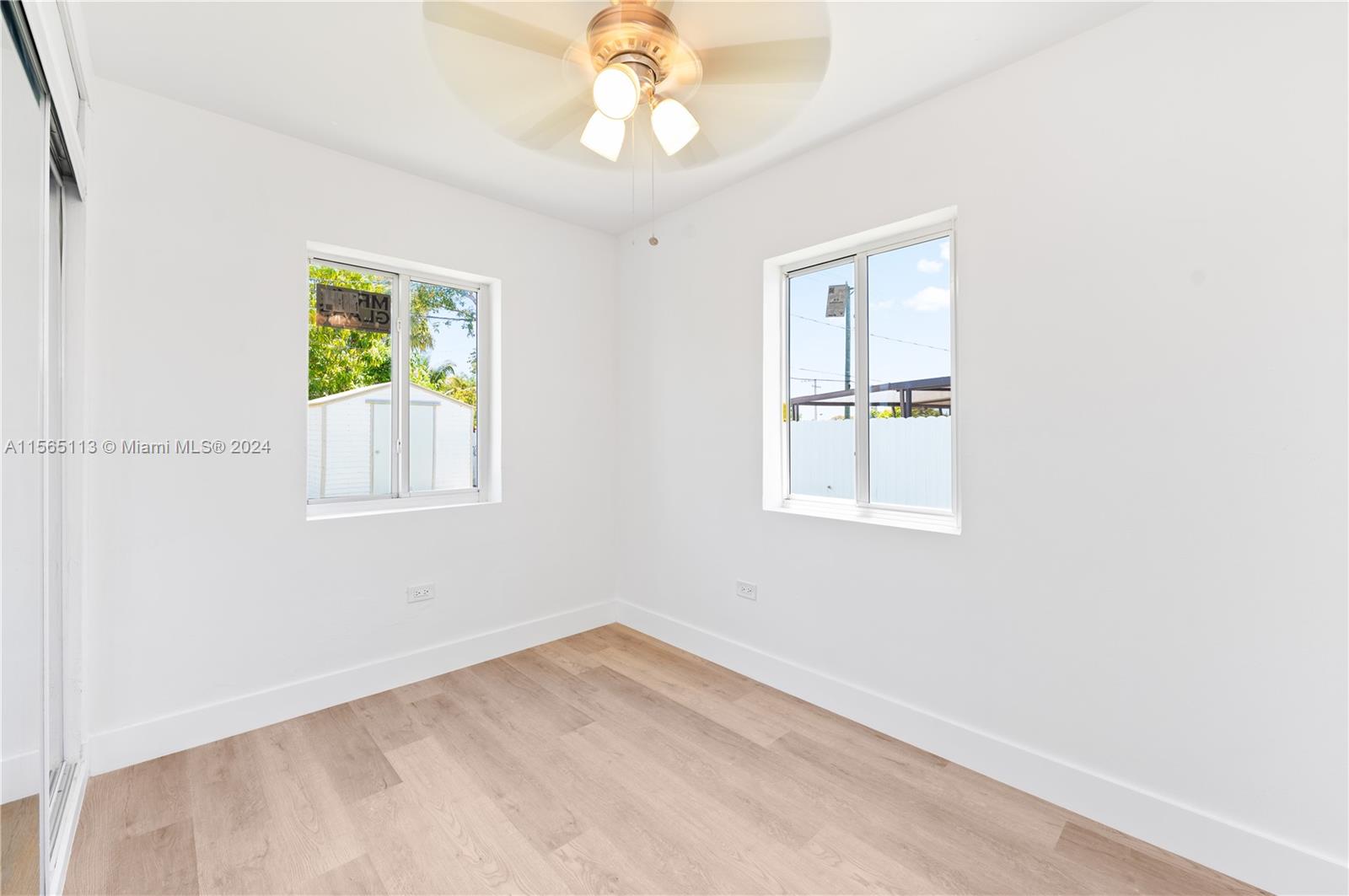 29451 Maine Road Homestead, FL 33033 - Photo 12 of 22 a view of an empty room with a window