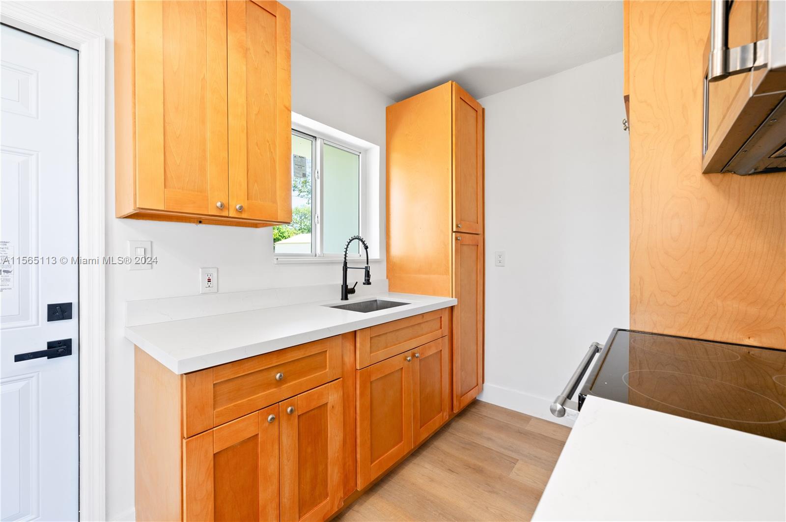 29451 Maine Road Homestead, FL 33033 - Photo 14 of 22 a kitchen with a sink and a window