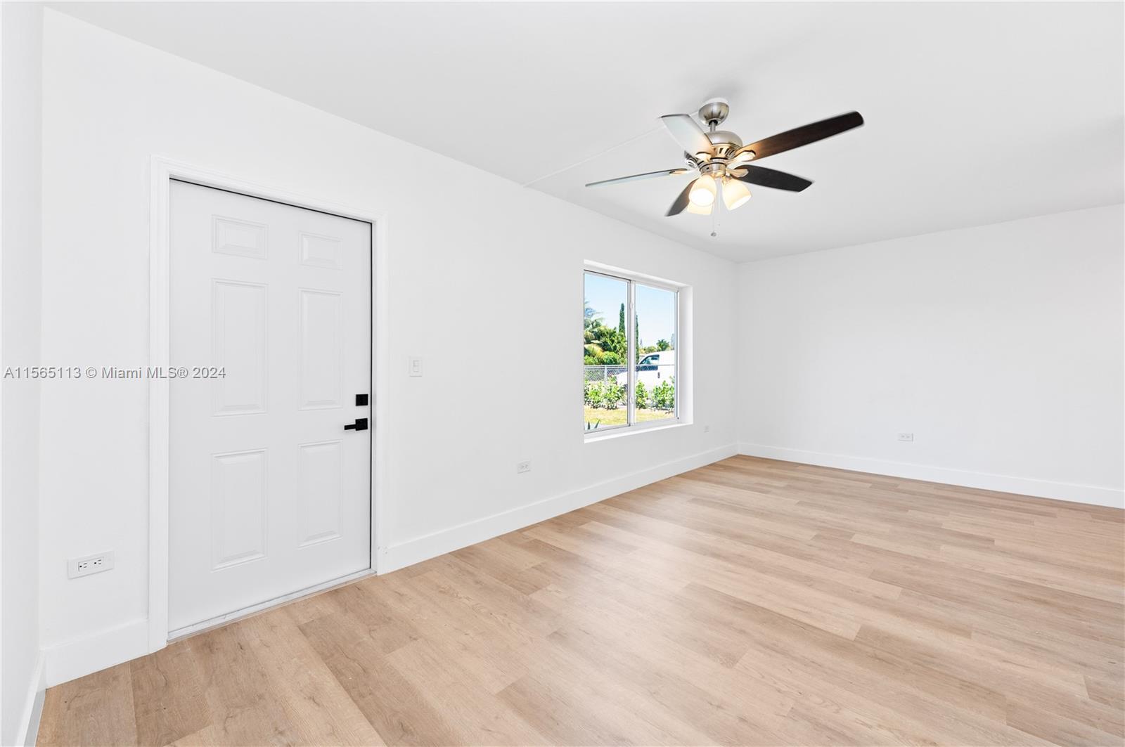 29451 Maine Road Homestead, FL 33033 - Photo 19 of 22 a view of an empty room with a window