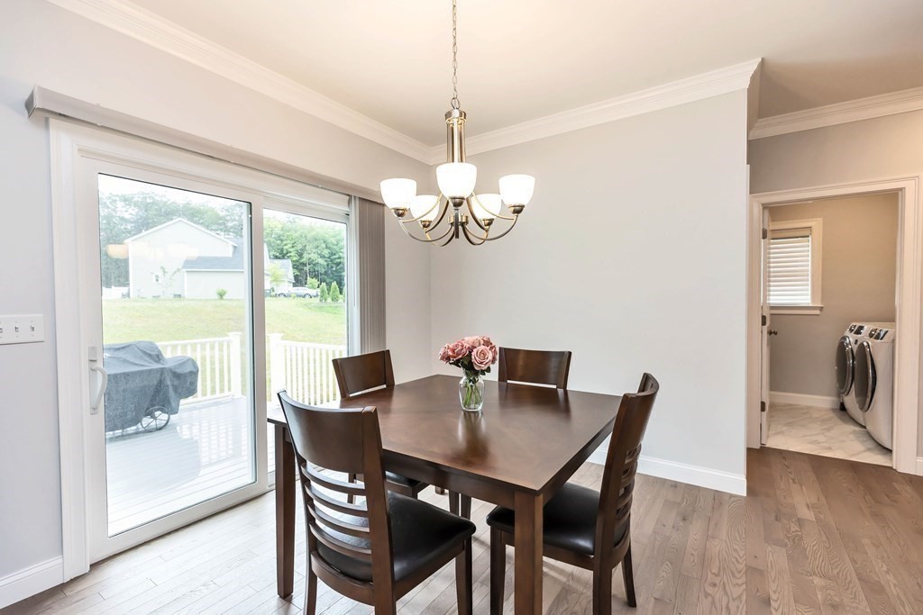 95-1 Lowell Road, Unit 1 Pepperell, MA 01463 - Photo 13 of 36 a view of a dining room with furniture window and wooden floor