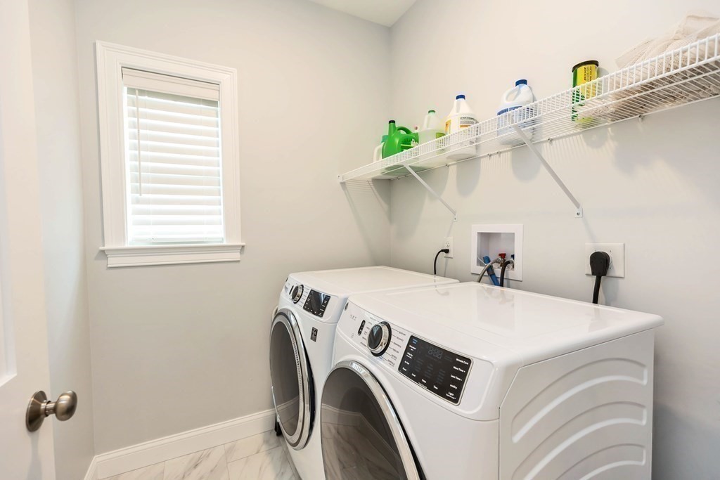95-1 Lowell Road, Unit 1 Pepperell, MA 01463 - Photo 15 of 36 a utility room with dryer and washer