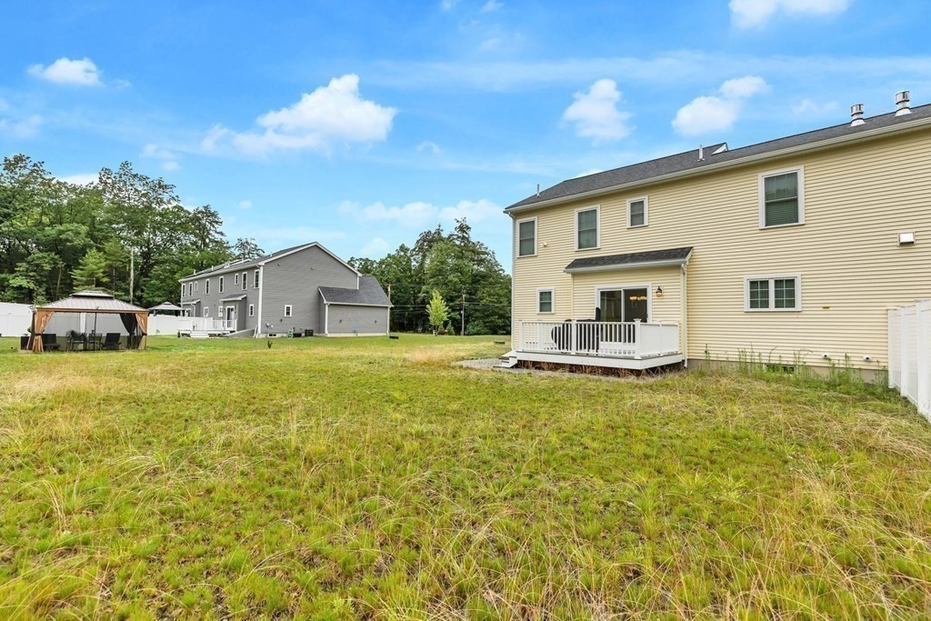 95-1 Lowell Road, Unit 1 Pepperell, MA 01463 - Photo 34 of 36 a house view with a outdoor space