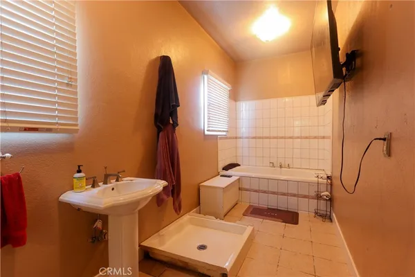 a bathroom with a sink and mirror