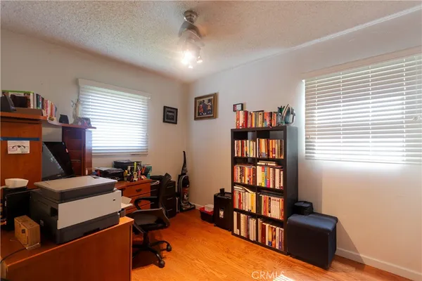 a living room with furniture workspace and a window