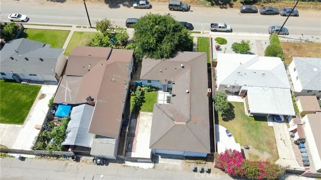 an aerial view of residential houses with outdoor space