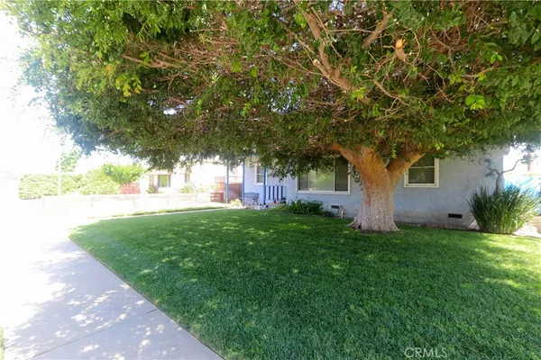 a view of a backyard of a house