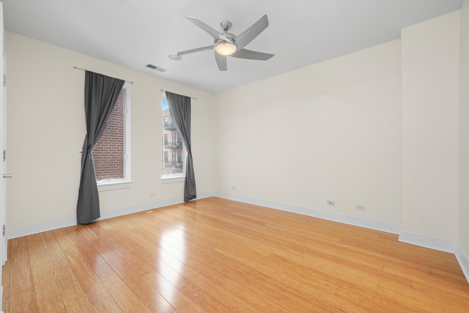 1055 West Monroe Street, Unit A Chicago, IL 60607 - Photo 13 of 28 a view of an empty room with a ceiling fan