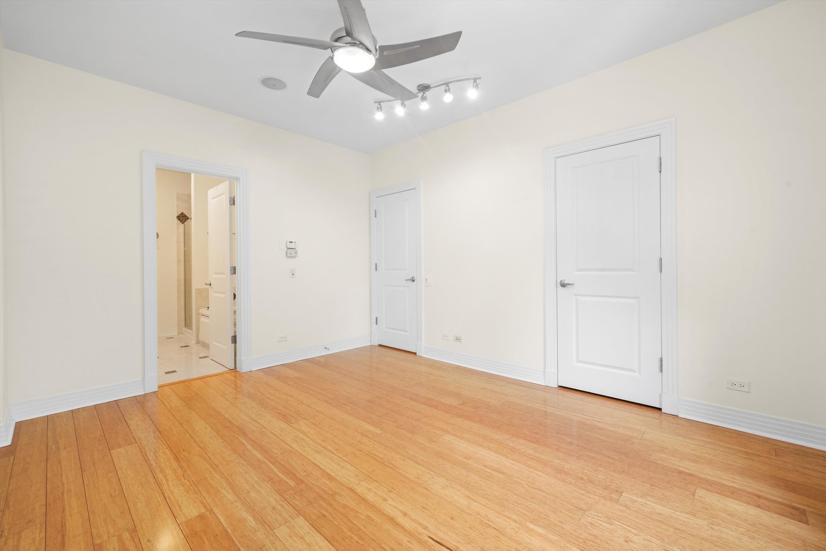 1055 West Monroe Street, Unit A Chicago, IL 60607 - Photo 14 of 28 wooden floor in an empty room