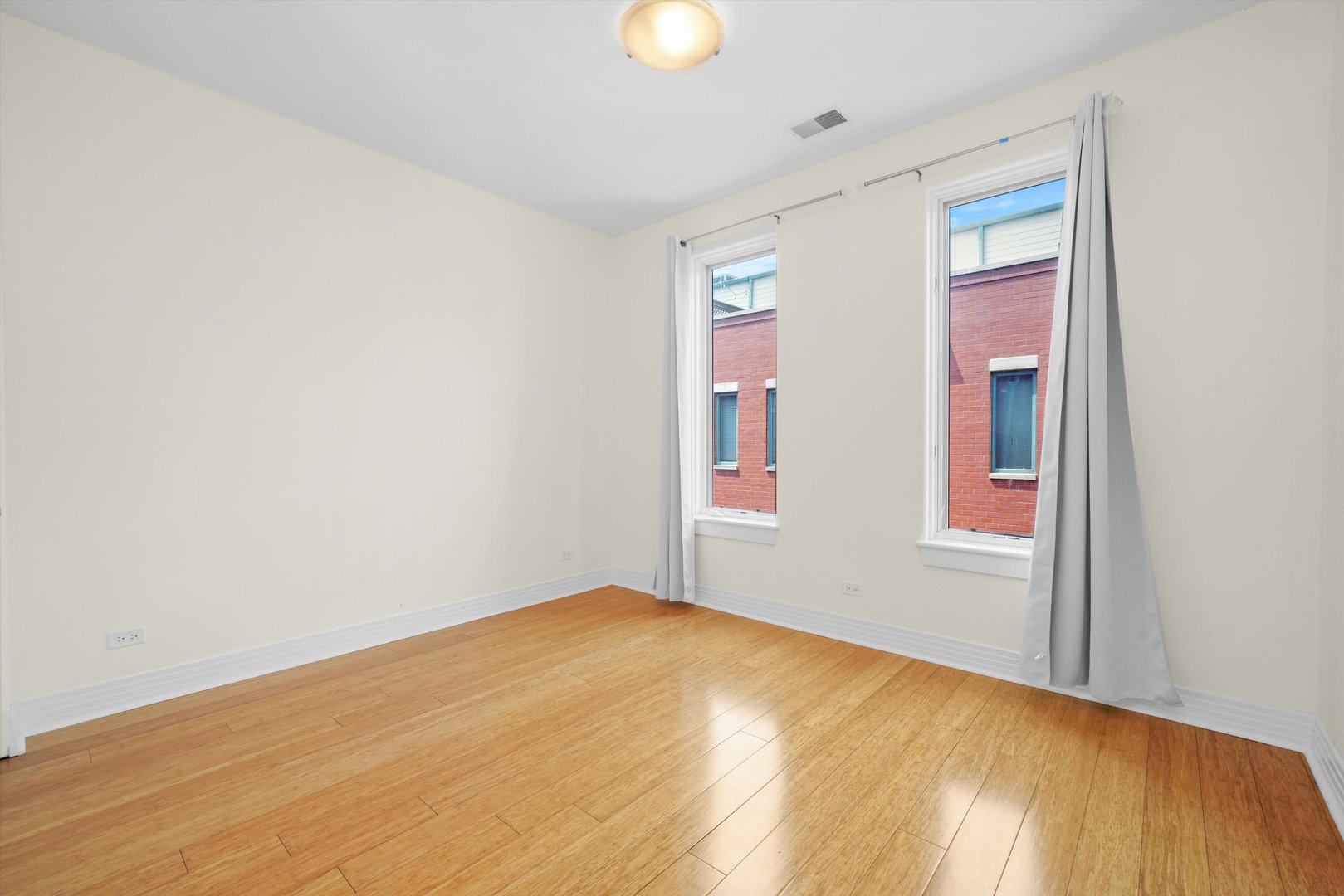1055 West Monroe Street, Unit A Chicago, IL 60607 - Photo 15 of 28 a view of an empty room with window and closet area