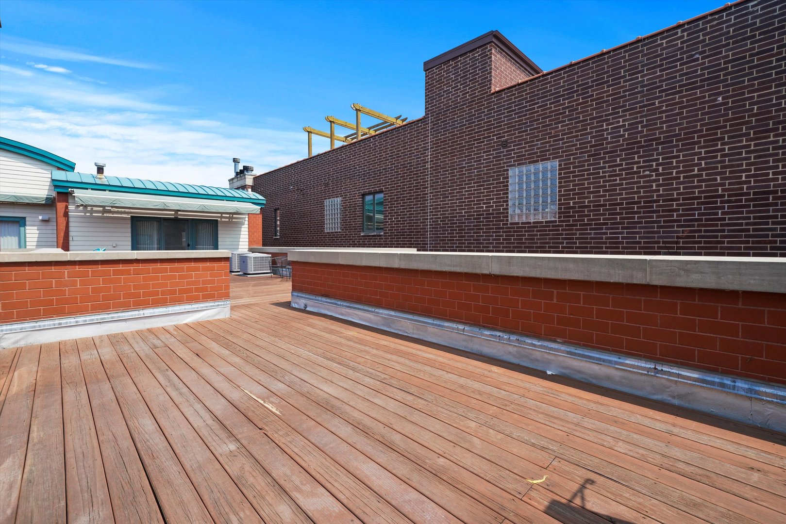1055 West Monroe Street, Unit A Chicago, IL 60607 - Photo 23 of 28 a view of outdoor space with wooden floor and seating space